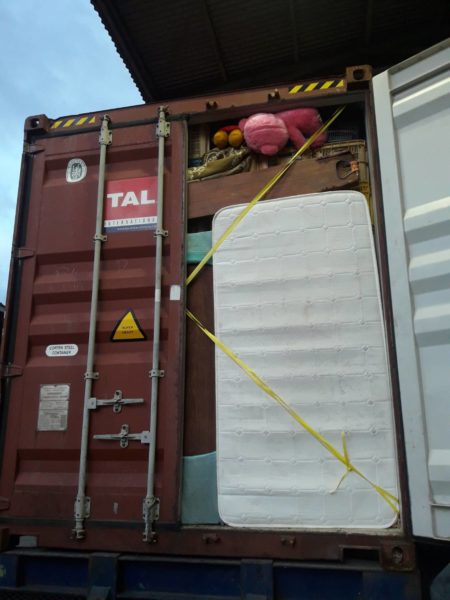 UNLOADING CONTAINER FOR THURSDAY AUCTION