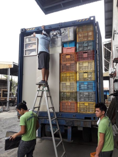 UNLOADING CONTAINER FOR CHRISTMAS PARTY AUCTION IN ALABANG